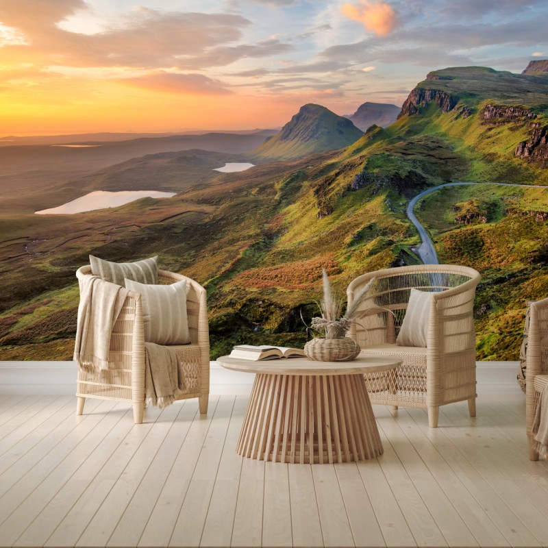 Fototapete sonnenuntergang über grünen hügeln