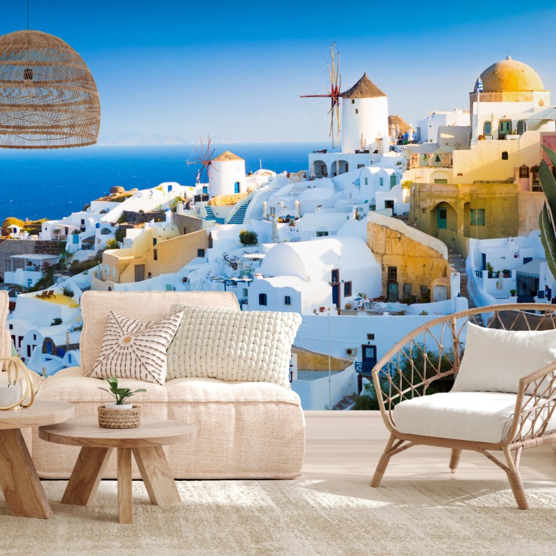 Fototapete sonnenbeschienenes Santorini-dorf am meer