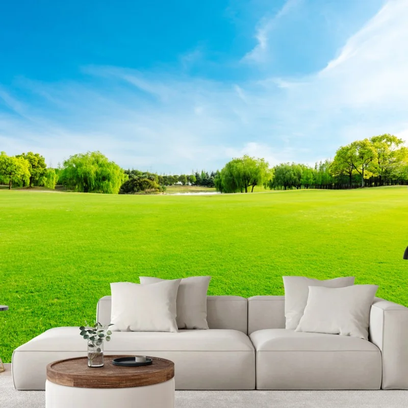 Fototapete friedliche grüne wiese unter blauem himmel