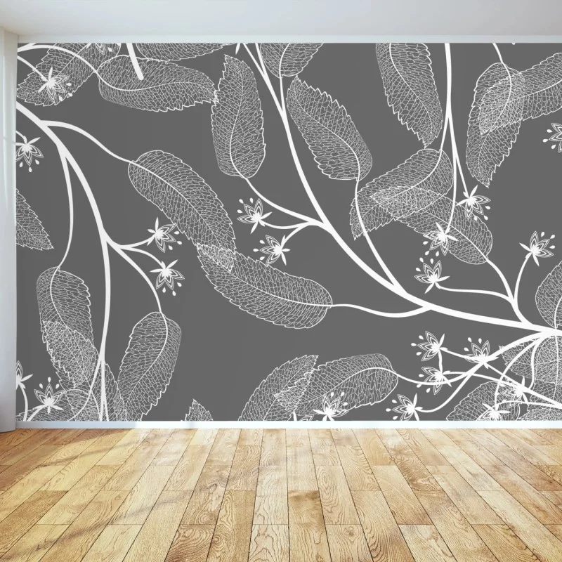 Fototapete zarte weiße blätter auf grauem hintergrund