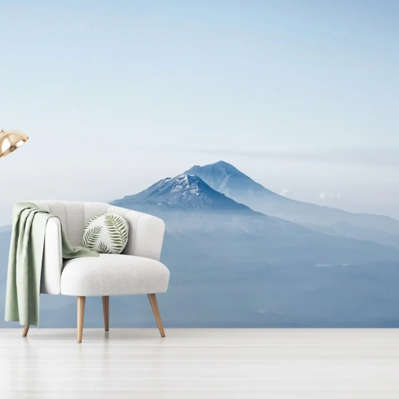 Fototapete neblige blaue berggipfel