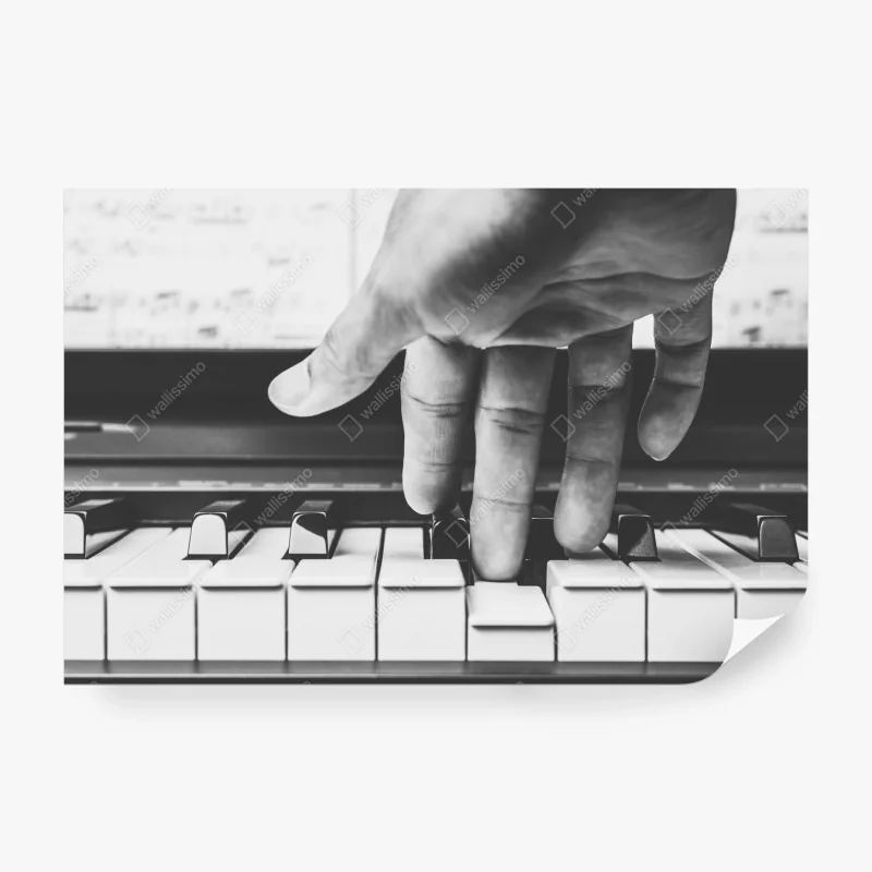 Fototapete hand auf klaviertasten