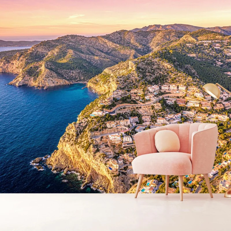 Fototapete sonnenuntergang über küstenlandschaft mit dorf am kliff