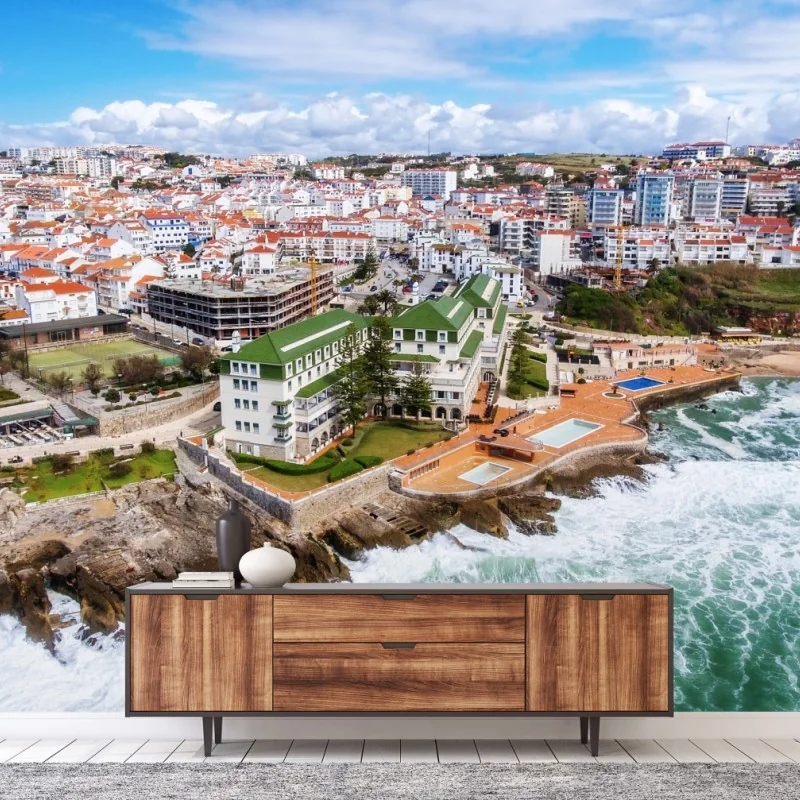 Fototapete luftaufnahme einer küstenstadt mit tosenden wellen