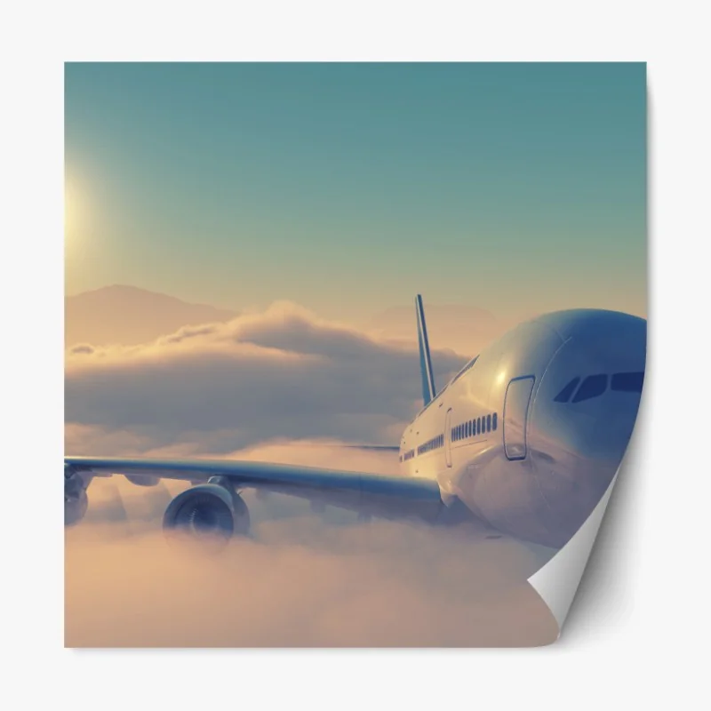 Repositionierbarer Aufkleber flugzeug über den wolken im morgengrauen