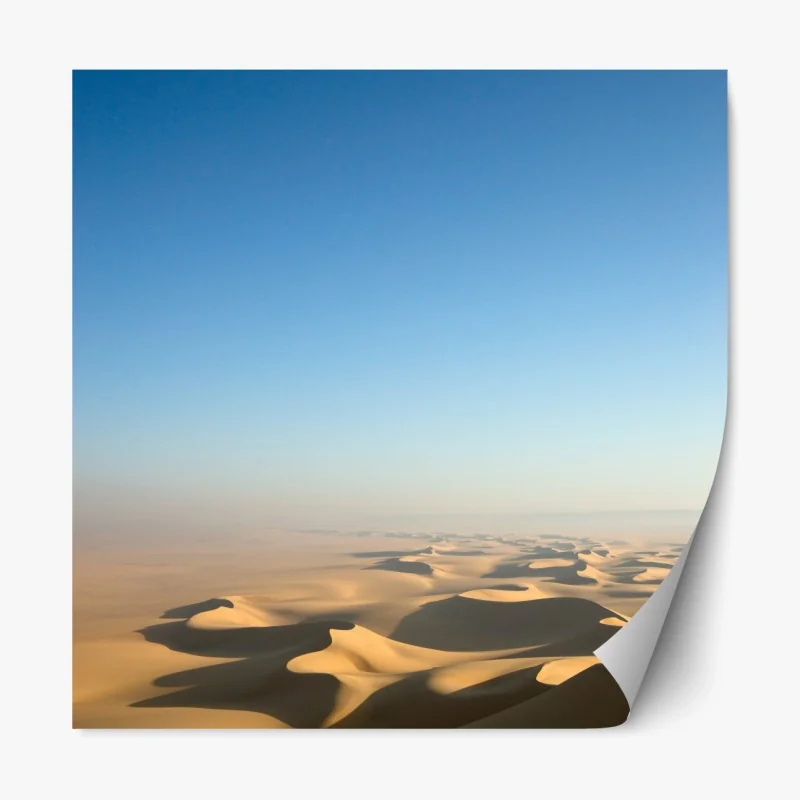 Repositionierbarer Aufkleber endlose wüstendünen unter blauem himmel