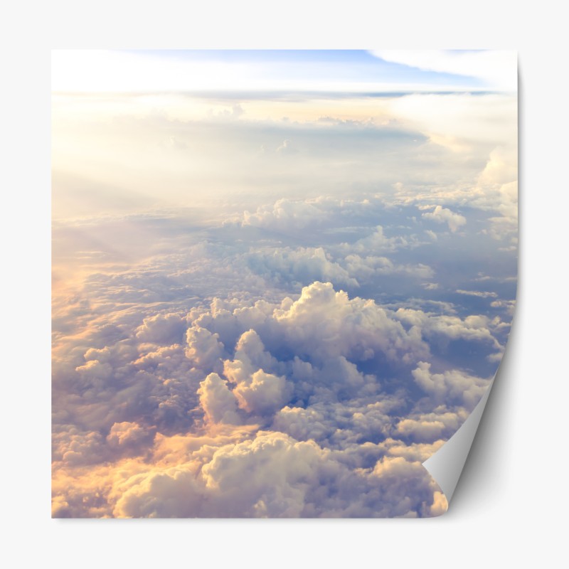 Repositionierbarer Aufkleber sonnenbeschienene wolken über dem horizont