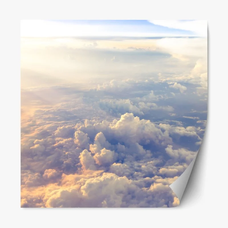 Repositionierbarer Aufkleber sonnenbeschienene wolken über dem horizont