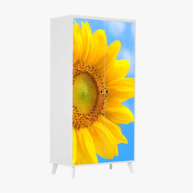 Schrankaufkleber leuchtende sonnenblume vor blauem himmel