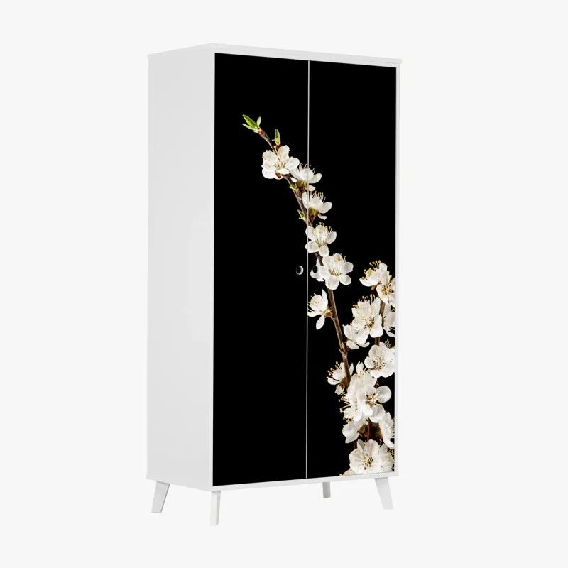 Schrankaufkleber zarter zweig mit aprikosenblüten auf schwarzem hintergrund