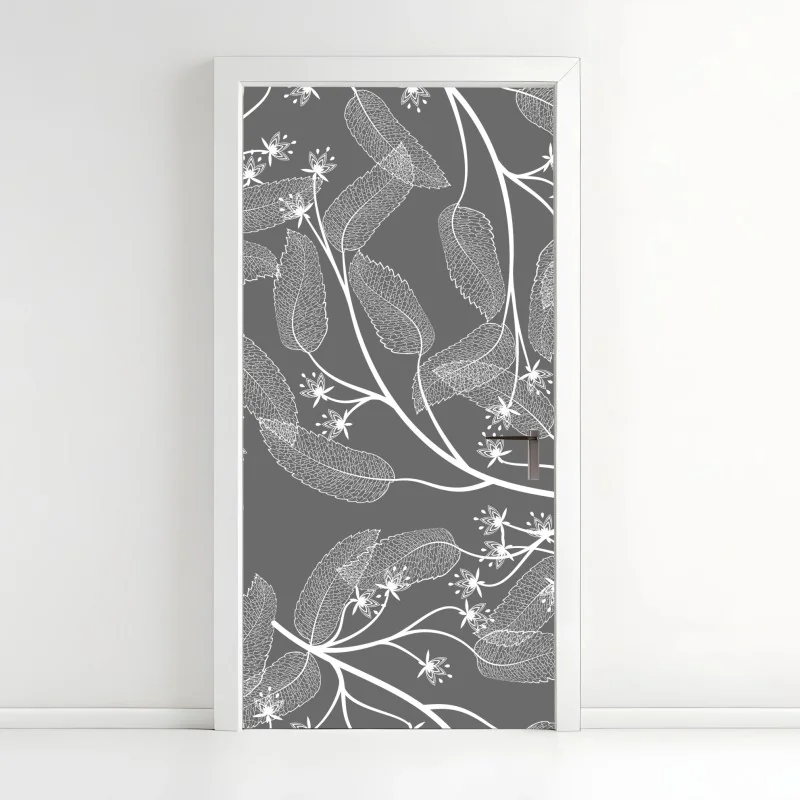 Türaufkleber zarte weiße blätter auf grauem hintergrund