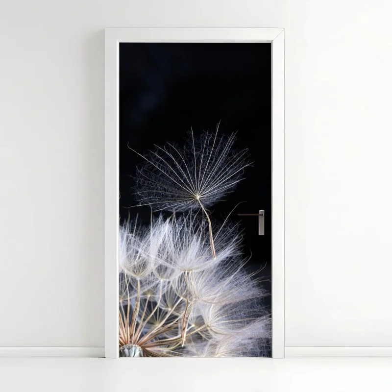 Türaufkleber zarter löwenzahnsamen auf schwarzem hintergrund