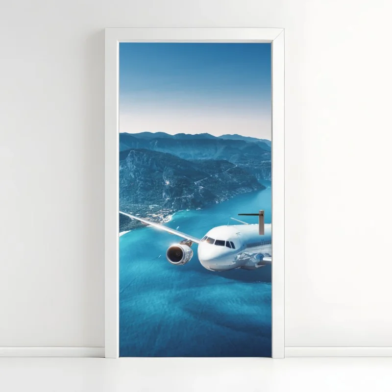 Türaufkleber küstenflug über türkisblauem meer