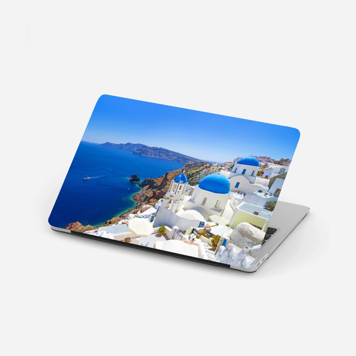 Laptop-Aufkleber Santorini blaue kuppeln über der kaldera – Wallnifity®