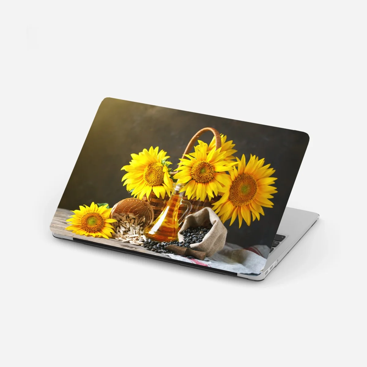 Laptop-Aufkleber leuchtendes stillleben mit sonnenblumen, kernen und öl – Wallnifity® Laptop-Aufkleber leuchtendes stillleben mit sonnenblumen, kernen und öl – Wallnifity®