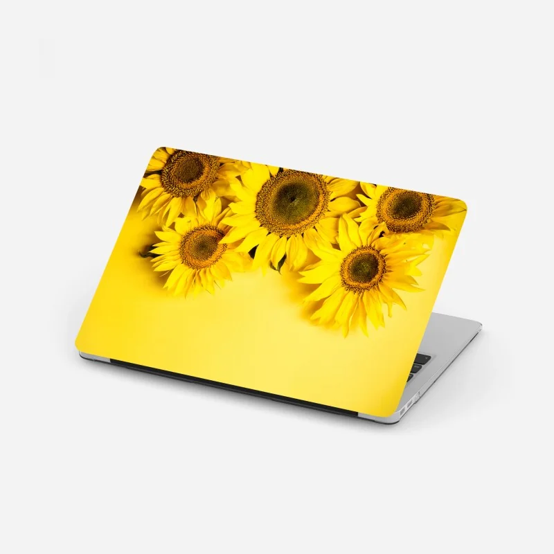Laptop-Aufkleber leuchtender sonnenblumenstrauß auf gelbem hintergrund