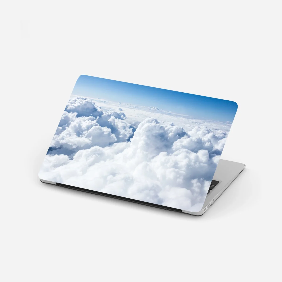 Laptop-Aufkleber blick von oben: sanfte wolken und blauer himmel – Wallnifity®