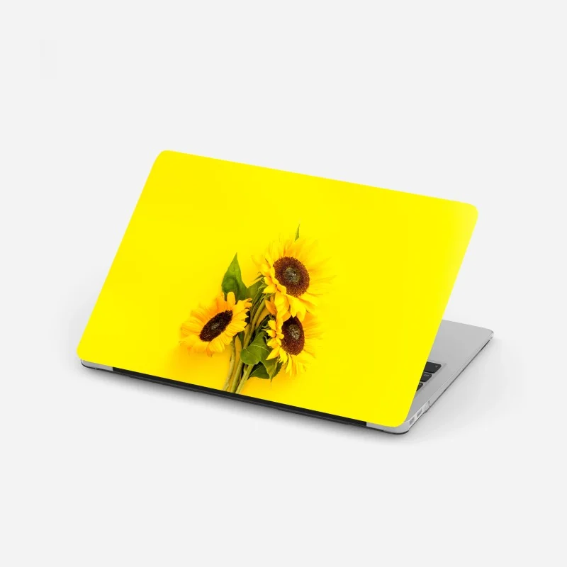 Laptop-Aufkleber leuchtender sonnenblumenstrauß auf gelbem hintergrund