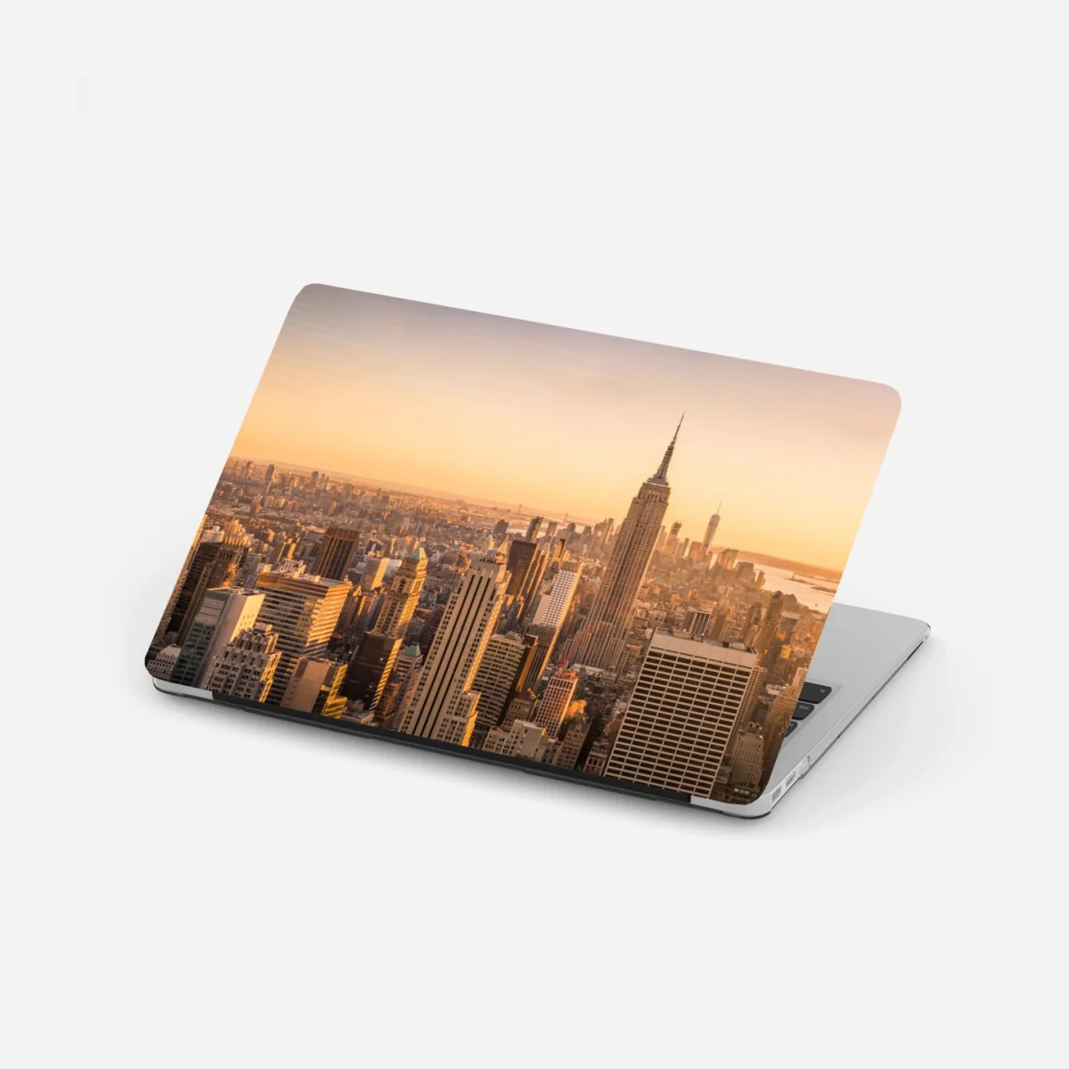 Laptop-Aufkleber goldener sonnenuntergang über der skyline von New York – Wallnifity® Laptop-Aufkleber goldener sonnenuntergang über der skyline von New York – Wallnifity®