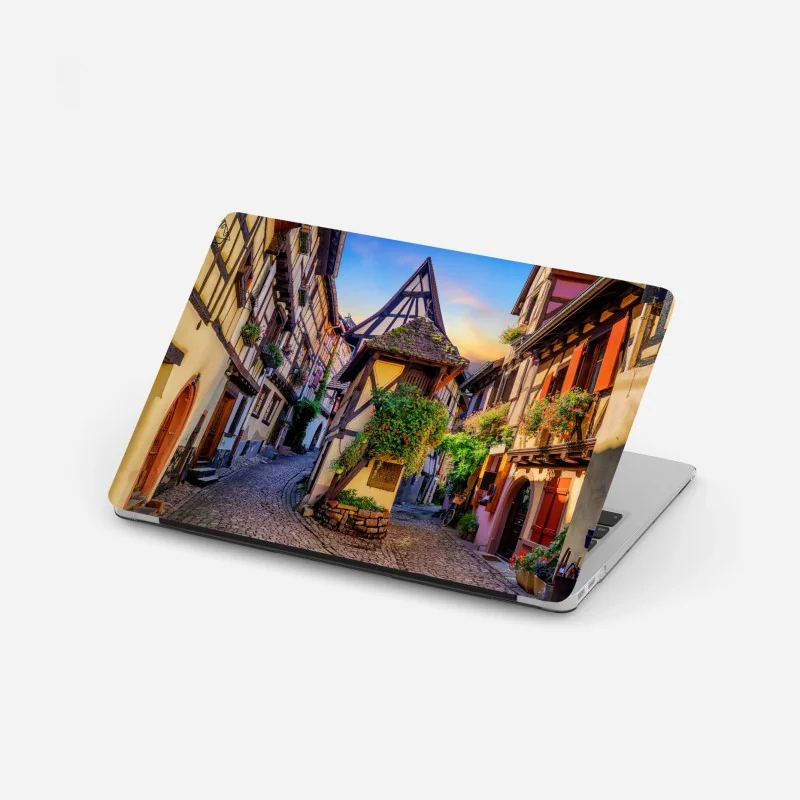 Laptop-Aufkleber sonnenuntergang über küstenlandschaft mit dorf am kliff – Wallnifity®