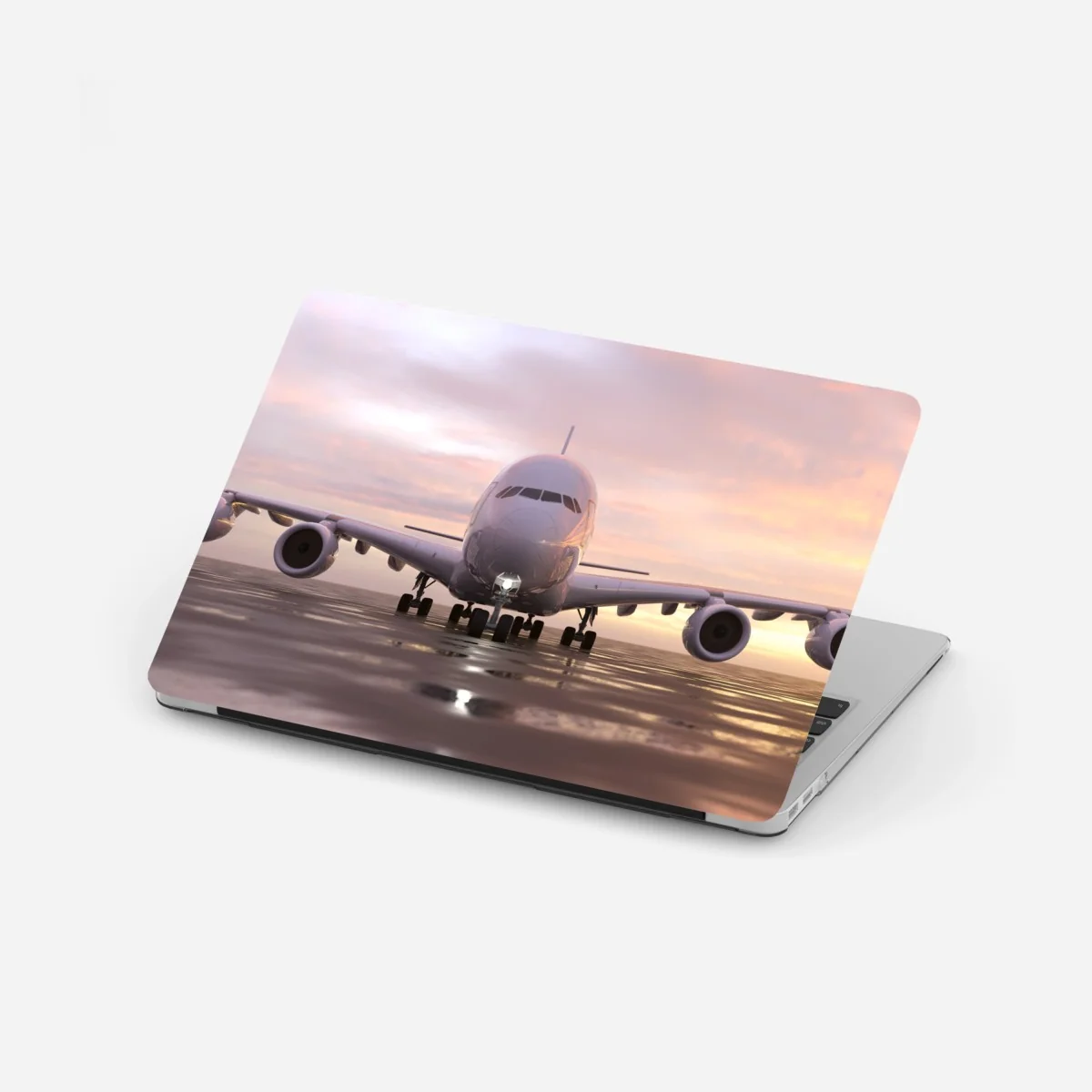 Laptop-Aufkleber jet auf der startbahn bei sonnenuntergang – Wallnifity®