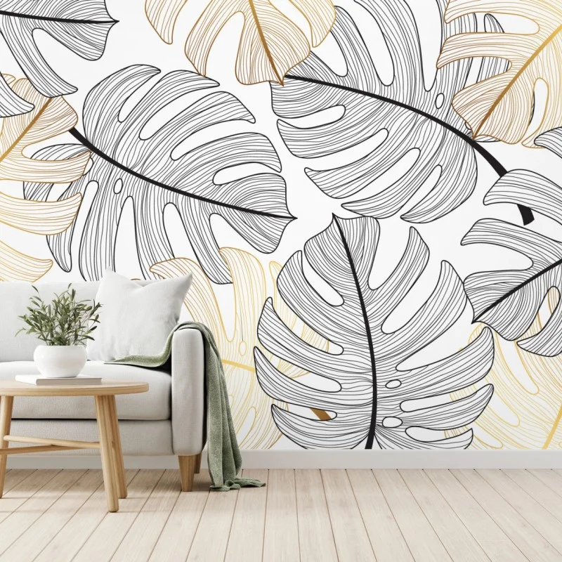 Fototapete monstera-blattmuster mit goldakzenten