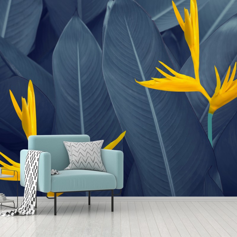 Fototapete gelbe strelitzie auf blauen blättern
