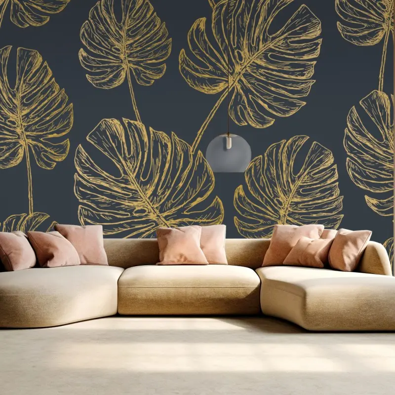 Fototapete goldene monstera-blätter auf dunklem hintergrund