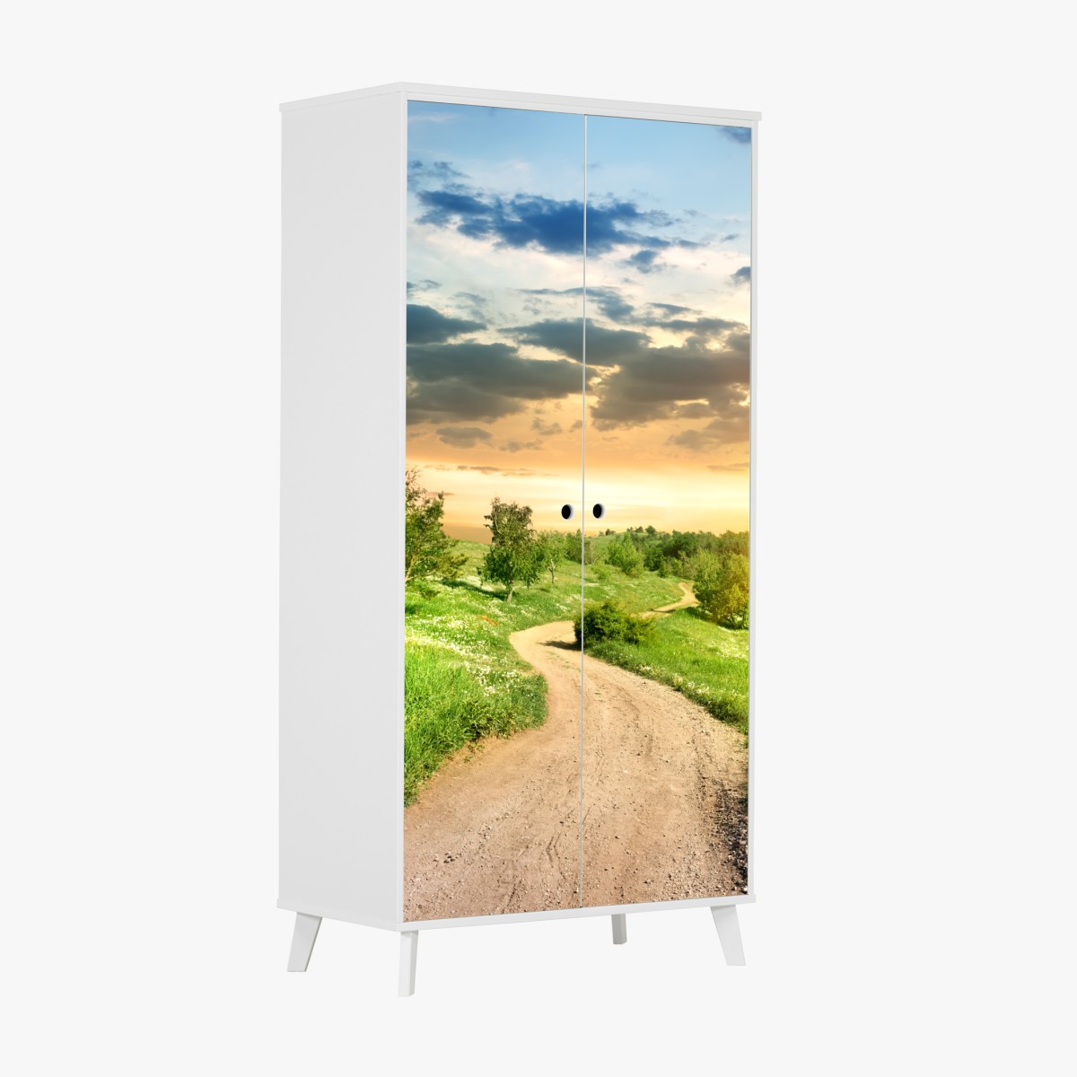 Schrankaufkleber sonnenuntergang über einem feldweg durch grüne wiese – Wallnifity®