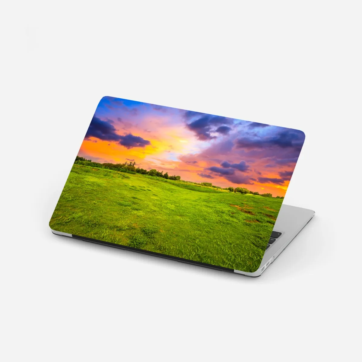 Laptop-Aufkleber sonnenuntergang über grüner wiese – Wallnifity®