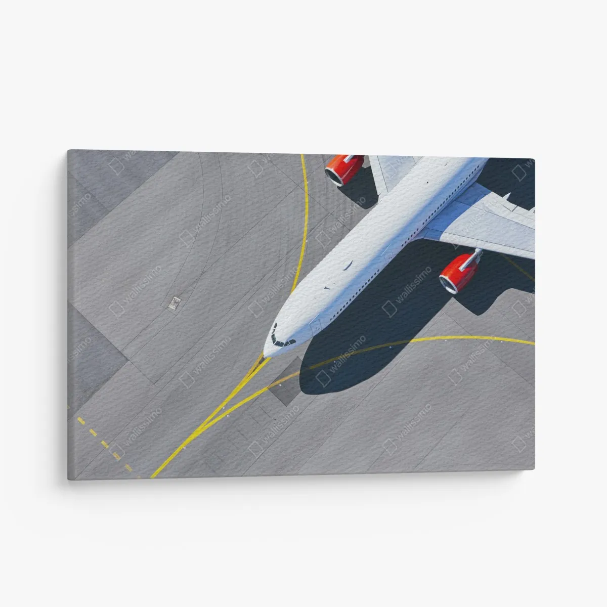 Leinwandbild luftaufnahme eines flugzeugs auf dem rollfeld – Wallnifity®