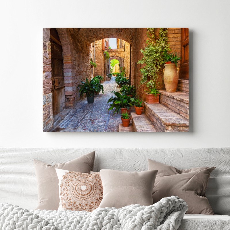 Leinwandbild sonnige gasse mit blumentöpfen in Spello – Wallnifity® Leinwandbild sonnige gasse mit blumentöpfen in Spello – Wallnifity®